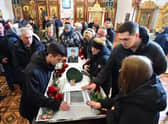 Relatives of Russian serviceman Nikita Avrov, 20, who was killed in Ukraine in March, at his funeral service in the town of Luga (Picture: AFP via Getty Images)
