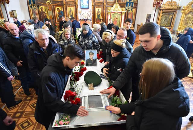 Relatives of Russian serviceman Nikita Avrov, 20, who was killed in Ukraine in March, at his funeral service in the town of Luga (Picture: AFP via Getty Images)