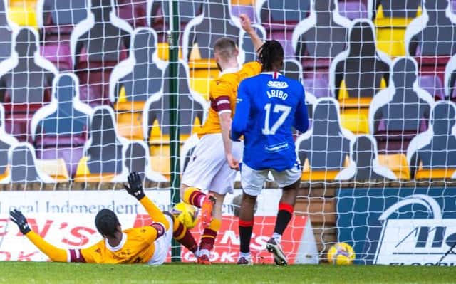 Devante Cole slides in to give Motherwell the lead against Rangers at Fir Park. (Photo by Craig Williamson / SNS Group)