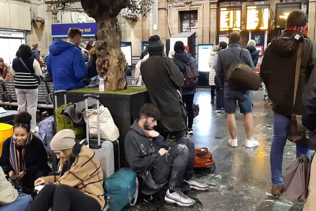 Passengers in the booking hall at Edinburgh Waverley Station during Thursday evening's disruption. (Photo by Alastair Dalton/The Scotsman)