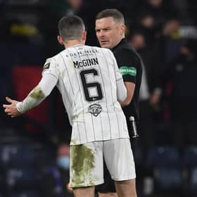 Hibs' Paul McGinn (L) confronts referee John Beaton during the Premier Sports Cup Final between Celtic and Hibernian at Hampden Park, on December 19, 2021, in Glasgow, Scotland. (Photo by Craig Foy / SNS Group)