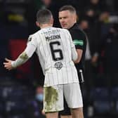 Hibs' Paul McGinn (L) confronts referee John Beaton during the Premier Sports Cup Final between Celtic and Hibernian at Hampden Park, on December 19, 2021, in Glasgow, Scotland. (Photo by Craig Foy / SNS Group)