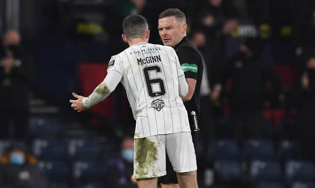 Hibs' Paul McGinn (L) confronts referee John Beaton during the Premier Sports Cup Final between Celtic and Hibernian at Hampden Park, on December 19, 2021, in Glasgow, Scotland. (Photo by Craig Foy / SNS Group)