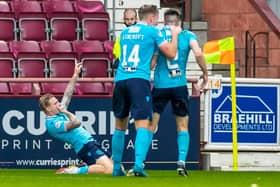 Dundee’s Jason Cummings celebrates after scoring to make it 1-1 against Hearts.