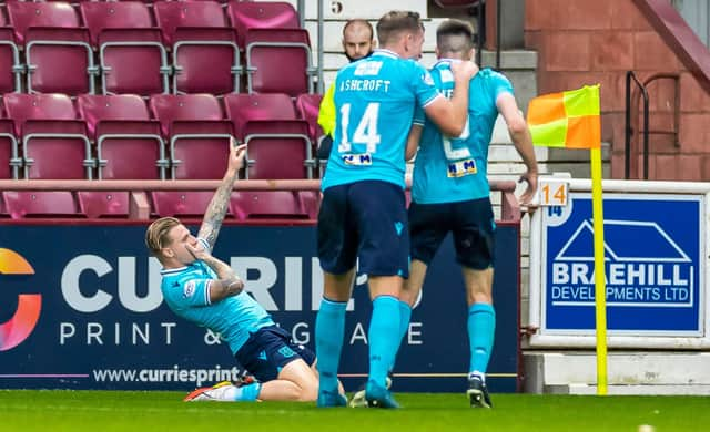 Dundee’s Jason Cummings celebrates after scoring to make it 1-1 against Hearts.