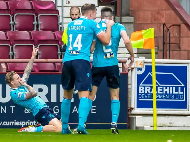 Dundee’s Jason Cummings celebrates after scoring to make it 1-1 against Hearts.