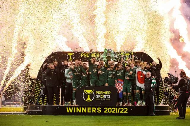 Celtic Captain Callum McGregor lifts the Premier Sports Cup Trophy
 during the Premier Sports Cup Final between Celtic and Hibernian at Hampden Park, on December 19, 2021, in Glasgow, Scotland. (Photo by Alan Harvey / SNS Group)