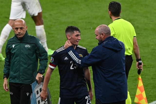 Scotland's midfielder Billy Gilmour (C) and Scotland's coach Steve Clarke (R) react after the UEFA EURO 2020 Group D  match between England and Scotland at Wembley. (Photo by FACUNDO ARRIZABALAGA/POOL/AFP via Getty Images)