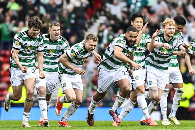 Celtic's Matt O'Riley, Maik Nawrocki, Alistair Johnston, Cameron Carter-Vickers, Tomoki Iwata and Liam Scales celebrate at full time after beating Aberdeen on penalties.