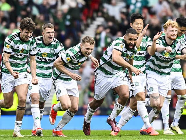 Celtic's Matt O'Riley, Maik Nawrocki, Alistair Johnston, Cameron Carter-Vickers, Tomoki Iwata and Liam Scales celebrate at full time after beating Aberdeen on penalties.
