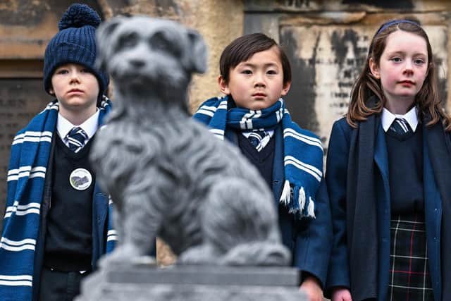Pupils from George Heriot's School attend a memorial service commemorating the 150th anniversary since the death of Greyfriars Bobby in Greyfriars Kirkyard. Picture: Jeff J Mitchell/Getty Images
