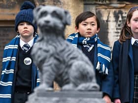 Pupils from George Heriot's School attend a memorial service commemorating the 150th anniversary since the death of Greyfriars Bobby in Greyfriars Kirkyard. Picture: Jeff J Mitchell/Getty Images