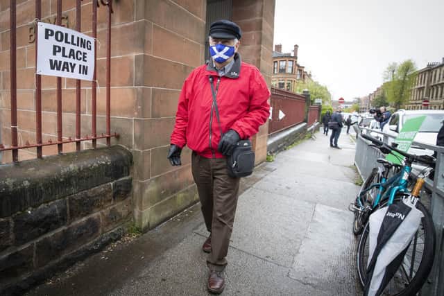 A voter heads to a polling station yesterday but the full results are not expected to be known until tomorrow (Picture: Jane Barlow/PA Wire)