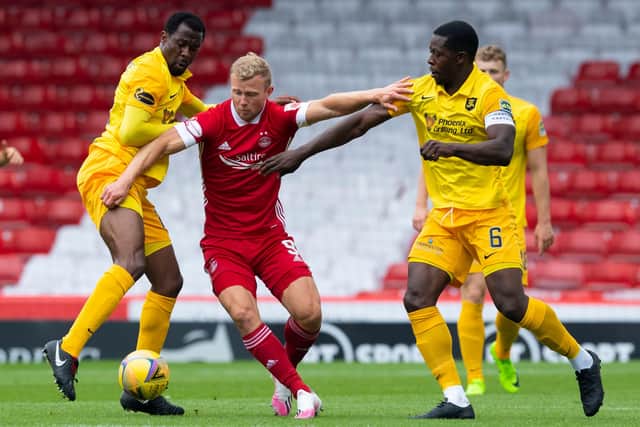 Livingston duo Marvin Bartley and Efe Ambrose.