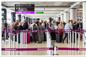 Passengers queue at Edinburgh Airport