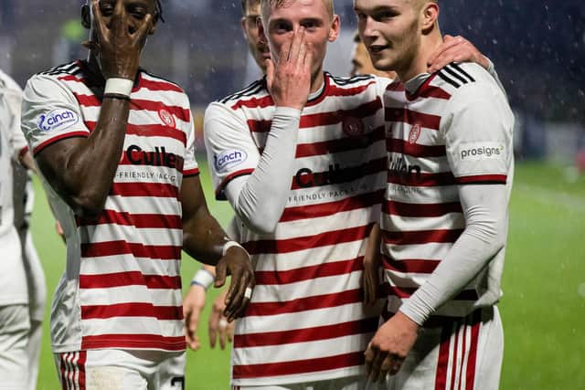 Hamilton players celebrate after making it 2-0 during a cinch Championship match between Queen of the South and Hamilton at Palmerston Park, on January 02, 2022, in Dumfries, Scotland. (Photo by Bruce White / SNS Group)