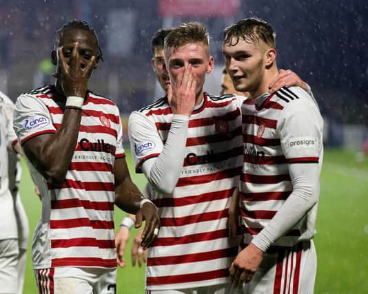 Hamilton players celebrate after making it 2-0 during a cinch Championship match between Queen of the South and Hamilton at Palmerston Park, on January 02, 2022, in Dumfries, Scotland. (Photo by Bruce White / SNS Group)