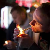 A man smokes cannabis in a coffee shop in Amsterdam.