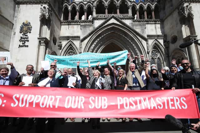 Former Post Office workers celebrate outside the Royal Courts of Justice in London, after their convictions were overturned by the Court of Appeal (Picture: Yui Mok/PA)