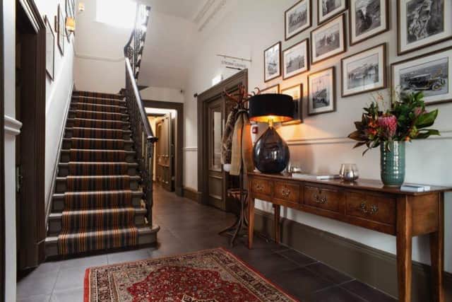 The hallway to Hampton House, decorated with images of Orkney, a flavour that runs throughout the two Houses, from decor to food and drink. Pic: Contributed