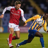 Angus Macdonald (left), pictured in action for previous club Rotherham, has joined Aberdeen following his release from Swindon Town.