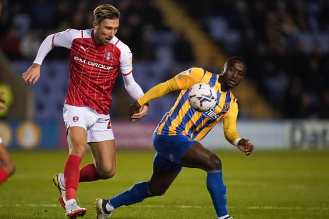 Angus Macdonald (left), pictured in action for previous club Rotherham, has joined Aberdeen following his release from Swindon Town.