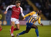 Angus Macdonald (left), pictured in action for previous club Rotherham, has joined Aberdeen following his release from Swindon Town.