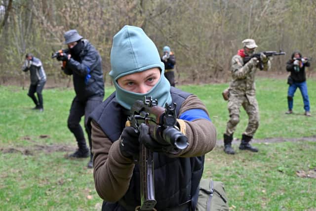 People take part in a combat training course run by the Ukrainian Armed Forces in Kharkiv (Picture: Sergey Bobok/AFP via Getty Images)