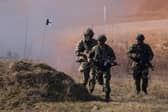 Soldiers from the 2nd Battalion Royal Anglian infantry unit storm an enemy position in a simulated attack during a Nato training exercise in Poland last year (Picture: Sean Gallup/Getty Images)