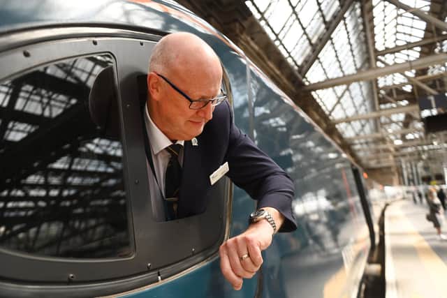 Pendolino train driver Neil Barker checking his watch after Avanti West Coast's failed attempt to break the London-Glasgow record. Picture: John Devlin