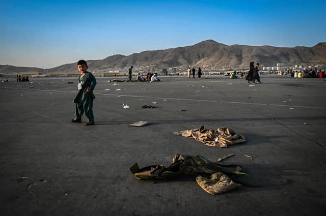 A young Afghan child at Kabul airport who was waiting with relatives in the hope of being evacuated. Some children have become separated from their families in the turmoil (Picture: Wakil Kohsar/AFP via Getty Images)