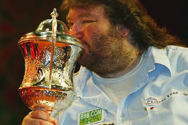 Andy Fordham kisses the trophy after beating Mervyn King in the final of The BDO Lakeside World Darts Championships in 2004. Picture: Julian Herbert/Getty Images