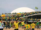 Supporters of Brazilian former President Jair Bolsonaro invade the National Congress in Brasilia on January 8, 2023. - Hundreds of supporters of Brazil's far-right ex-president Jair Bolsonaro broke through police barricades and stormed into Congress, the presidential palace and the Supreme Court Sunday, in a dramatic protest against President Luiz Inacio Lula da Silva's inauguration last week. (Photo by Sergio Lima / AFP) (Photo by SERGIO LIMA/AFP via Getty Images)