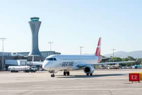 A flight lands at Edinburgh Airport, but will air travel become more expensive as fewer people are able to board the same flight? (Picture: Ian Georgeson)