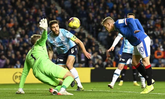 Rangers' Steven Davis nods home the only goal of the match in the 1-0 win over Dundee at Ibrox. (Photo by Rob Casey / SNS Group)