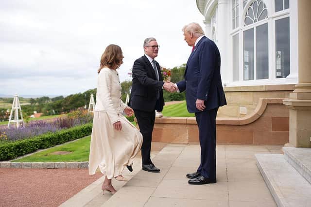 US President Donald Trump greets Prime Minister Keir Starmer and his wife Victoria at Trump Turnberry golf club yesterday (Picture: Andrew Harnik/Getty Images)