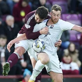 Craig Halkett challenges Jordan White during Hearts' 2-2 draw with Ross County.