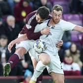 Craig Halkett challenges Jordan White during Hearts' 2-2 draw with Ross County.