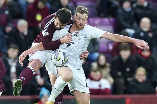 Craig Halkett challenges Jordan White during Hearts' 2-2 draw with Ross County.