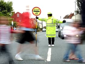 School crossing patrols are one of countless services in the firing line of councils tasked with balancing budgets. Picture: JPIMedia
