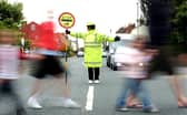 School crossing patrols are one of countless services in the firing line of councils tasked with balancing budgets. Picture: JPIMedia