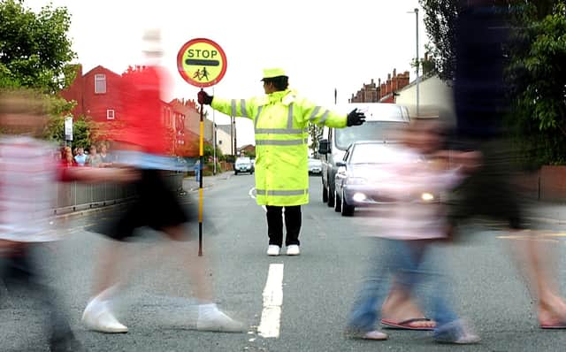 School crossing patrols are one of countless services in the firing line of councils tasked with balancing budgets. Picture: JPIMedia