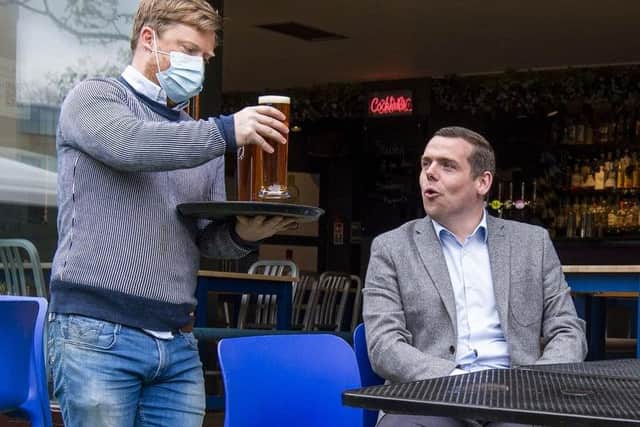 Douglas Ross pictured receiving a freshly poured pint at 56 North in Edinburgh. Photo: Lisa Ferguson