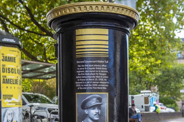 A black postbox featuring an image of Second Lieutenant Walter Tull, on Byres Road, Glasgow, one of four special edition postboxes unveiled by Royal Mail to mark Black History Month.
