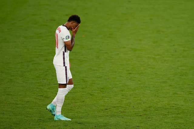 England's forward Marcus Rashford reacts after he fails to score in the penalty shootout during the UEFA EURO 2020 final football match between Italy and England at the Wembley Stadium in London. (Picture credit: John Sibley/Getty Images)