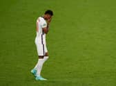England's forward Marcus Rashford reacts after he fails to score in the penalty shootout during the UEFA EURO 2020 final football match between Italy and England at the Wembley Stadium in London. (Picture credit: John Sibley/Getty Images)