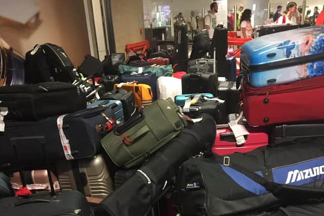 Luggage piled up at baggage reclaim at Edinburgh Airport last week. (Photo by Karen McAvoy)