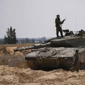 Israeli soldiers are seen near the border with the Gaza Strip, in southern Israel, on Tuesday. Photo: AP Photo/Tsafrir Abayo