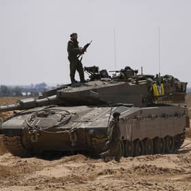 Israeli soldiers are seen near the border with the Gaza Strip, in southern Israel, on Tuesday. Photo: AP Photo/Tsafrir Abayo