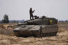 Israeli soldiers are seen near the border with the Gaza Strip, in southern Israel, on Tuesday. Photo: AP Photo/Tsafrir Abayo